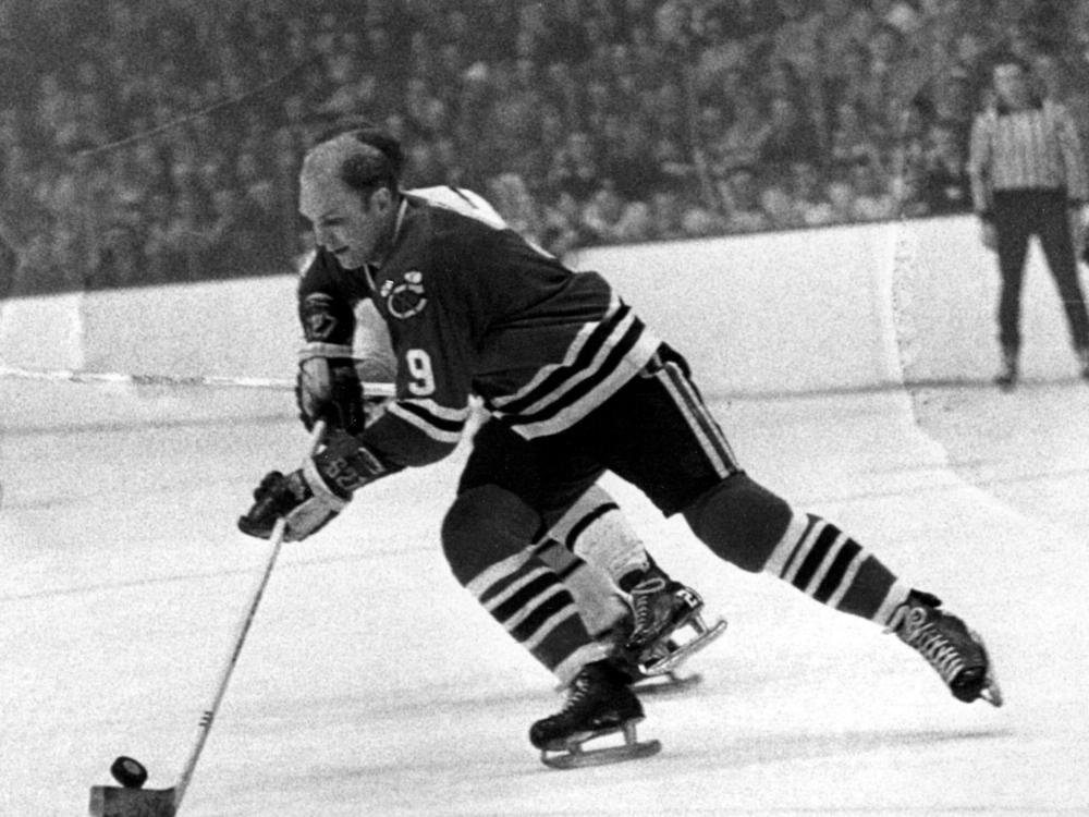 Bobby Hull of the Chicago Blackhawks skates down the ice with the puck during a hockey game against the Boston Bruins on Jan. 7, 1968. Hull would become one of the National Hockey League's 100 greatest players. His wife says repeated collisions during his Hall of Fame career led to his post-mortem diagnosis of CTE.