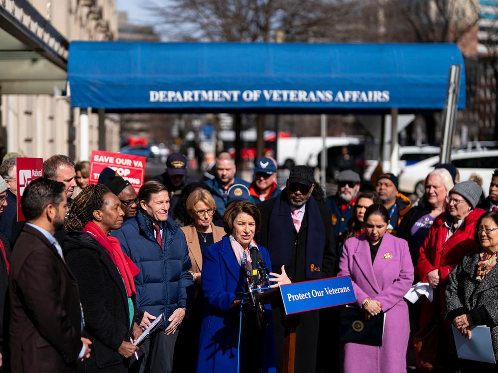 Sen. Amy Klobuchar, D-Minn., and other lawmakers speak at a rally outside the Department of Veterans Affairs headquarters in Washington, D.C. on Thursday.