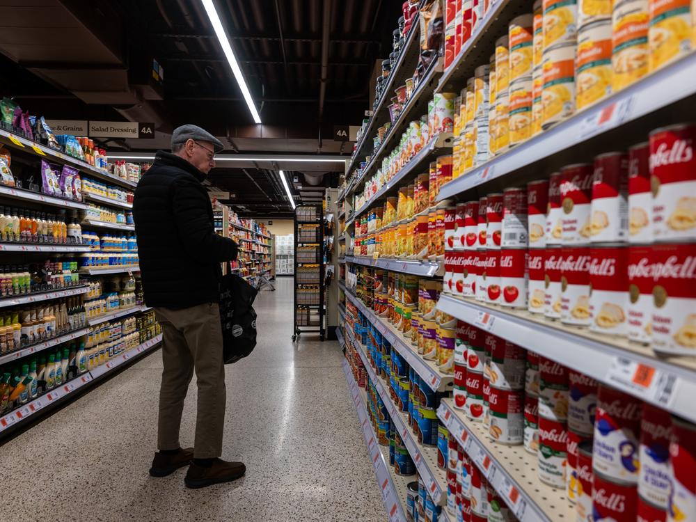 Canned soup and vegetables are displayed for sale in a New York City grocery store on Feb. 11. Some food and beverages could cost more if steel and aluminum can prices rise in response to U.S. tariffs.