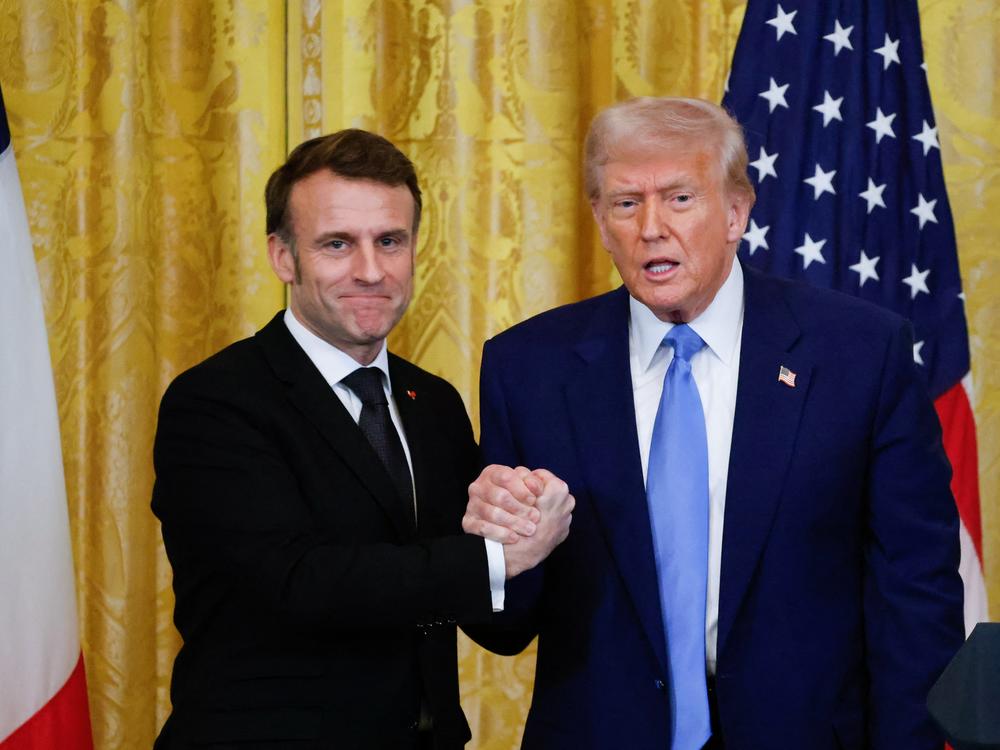 President Trump and French President Emmanuel Macron shake hands at the end of a joint press conference in the East Room of the White House on Monday.