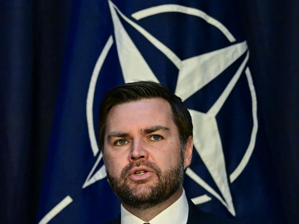Vice President JD Vance talks in front of the NATO logo at the Munich Security Conference in Munich, Germany, on Feb. 14.