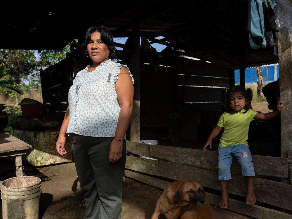 Alejandrina Muñoz (left) and her 3-year-old daughter, Cleidis, at their home in Limón de Chagres, Panama. Muñoz says she has everything she needs, including electricity and water.