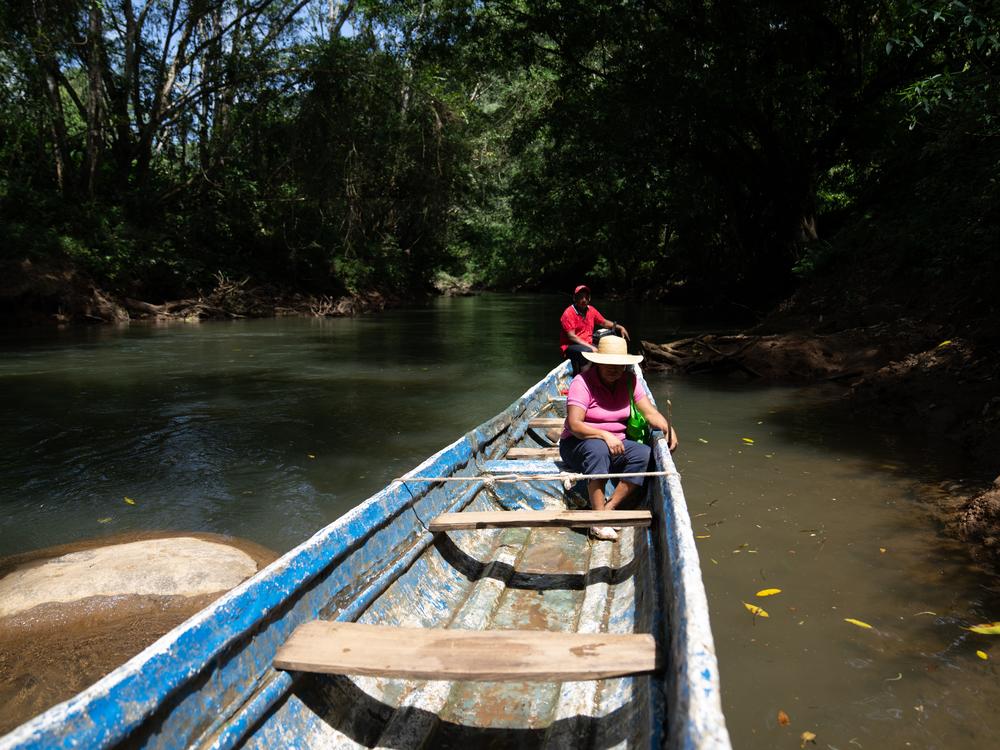 A dugout vessel, known locally as a cayuco, serves to transport Digna Benite along the waterways of rural Panama.
