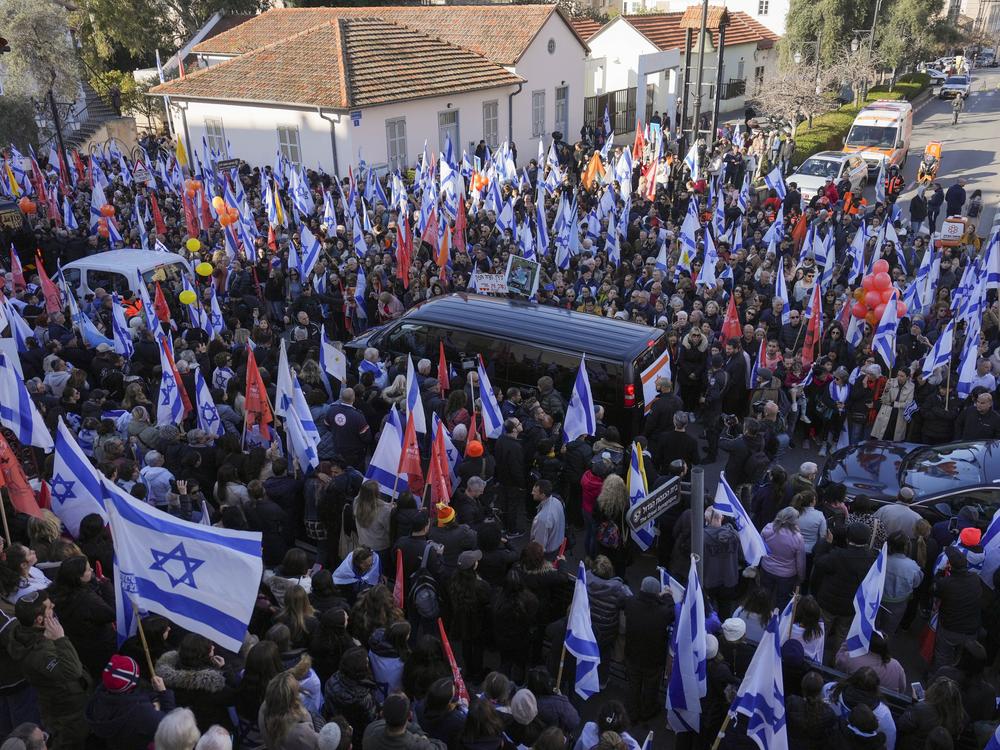 Mourners gather around the convoy carrying the coffins of slain hostages Shiri Bibas and her two children, Ariel and Kfir, during their funeral procession in Rishon Lezion, Israel on Wednesday.