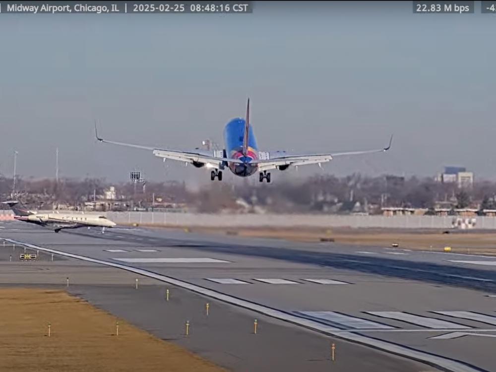 A screenshot from the StreamTime Live account on YouTube of the near-collision between a Southwest 737 plane and a private business jet at Chicago's Midway Airport. The 737 flight was arriving from Omaha, Neb. when the business jet mistakenly crossed the runway.