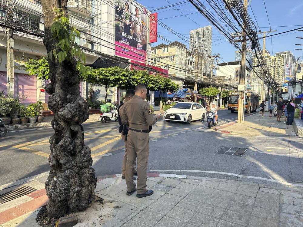 Police stand outside an immigration detention center of the Immigration Bureau where Uyghur detainees were held in Bangkok in January. The detainees said they were facing deportation back to China, where they fear persecution.