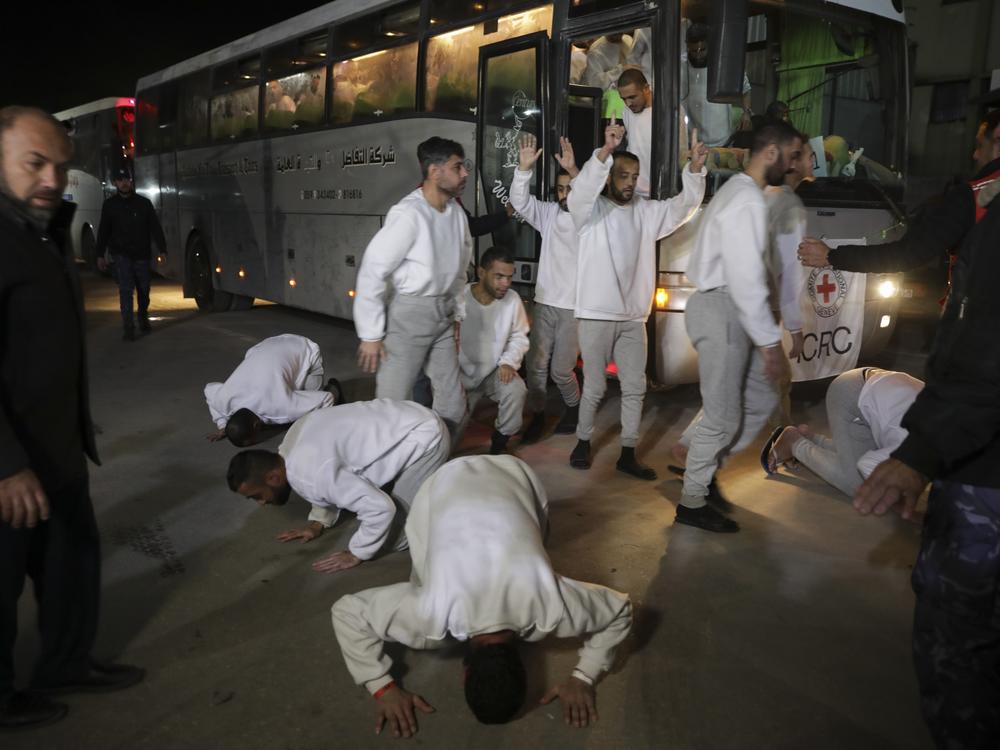 Freed Palestinian prisoners react as they arrive in the Gaza Strip after being released from an Israeli prison following a ceasefire agreement between Hamas and Israel in Khan Younis, Gaza Strip, on Thursday.