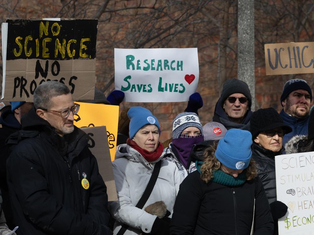 People protested funding cuts to research institutions at the University of Chicago last week.