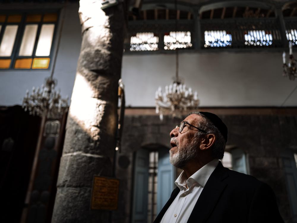 Rabbi Yusuf Hamra steps into the more than 500-year-old Faranj synagogue in Damascus for the first time in more than three decades. He left Syria, along with most of the country's historic Jewish population, in 1992.