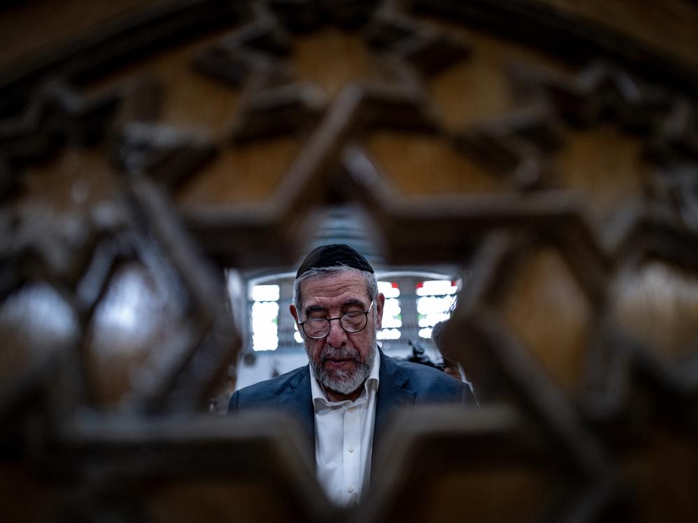 Rabbi Yusuf Hamra says prayers in the 500-year-old Faranj synagogue in Damascus.