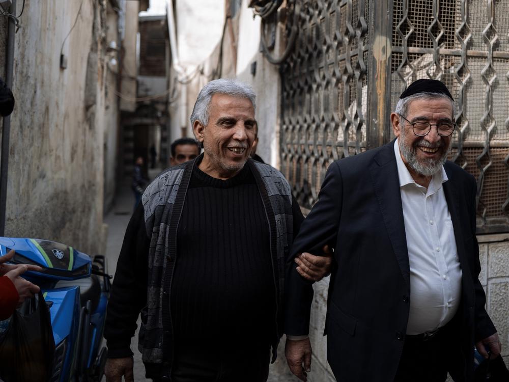 Rabbi Yusuf Hamra reconnects with a former neighbor from the Jewish quarter, which he left 33 years ago.