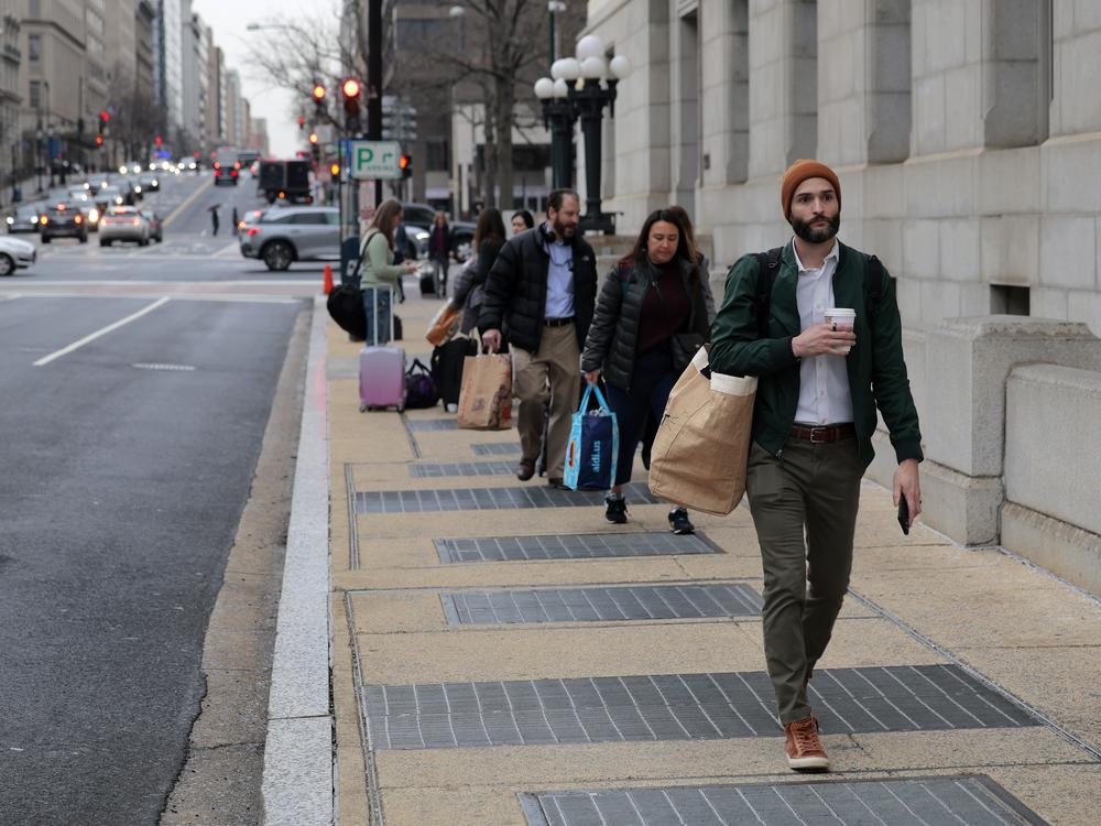 Former United States Agency for International Development (USAID) employees terminated after the Trump administration dismantled the agency collect their personal belongings at the USAID headquarters on February 27, 2025 in Washington, DC.