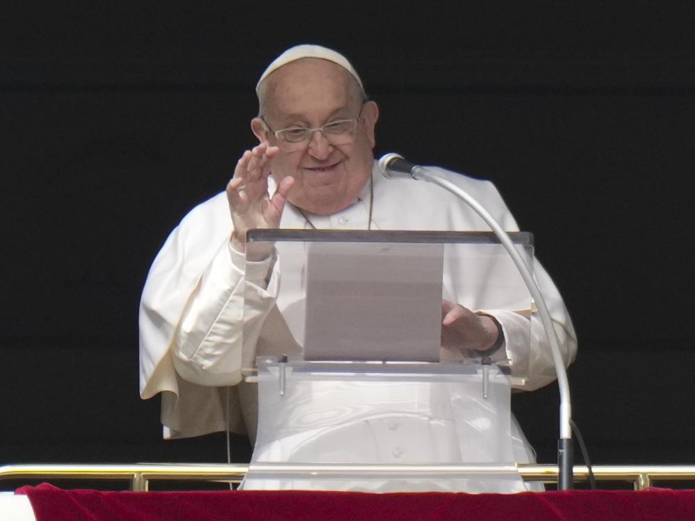 Pope Francis delivers his blessing as he recites the Angelus noon prayer from the window of his studio overlooking St. Peter's Square, at the Vatican, Sunday, Feb. 2, 2025.