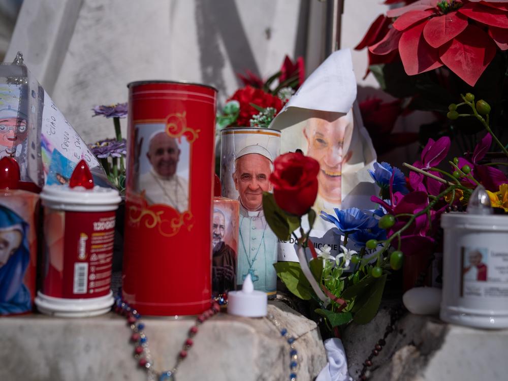 Flowers, balloons, candles and other items are laid outside Gemelli hospital in Rome, on Feb. 26, where Pope Francis is being treated.