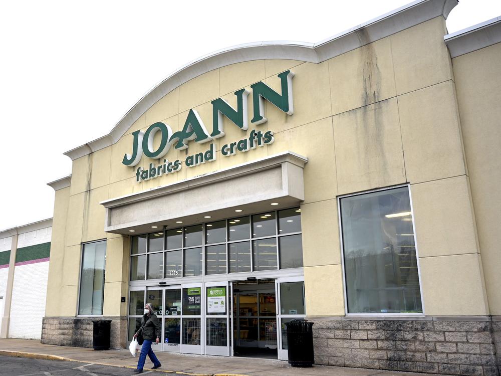 On Feb. 13, a customer walks out of a JOANN Fabric and Crafts store slated to close in Miami, Fla. The company announced it will close all of its roughly 800 stores across 49 U.S. states.