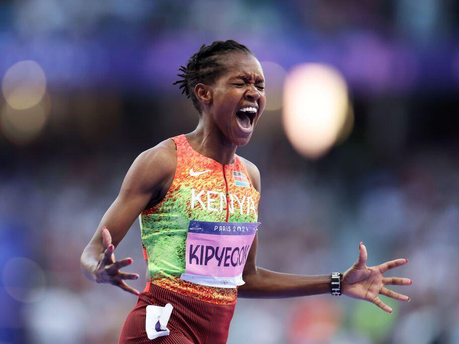Faith Kipyegon of Team Kenya celebrates winning the Gold medal and setting a new Olympic record in the Women's 1500m Final in August, 2024 in Paris.