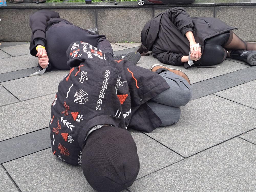 Members of the Ukrainian community in Taiwan and Taiwanese activists stage a performance drawing attention to the Ukrainian civilians killed, tortured and imprisoned as a result of Russia's invasion to mark the three-year anniversary of Russia's full-scale invasion of Ukraine.