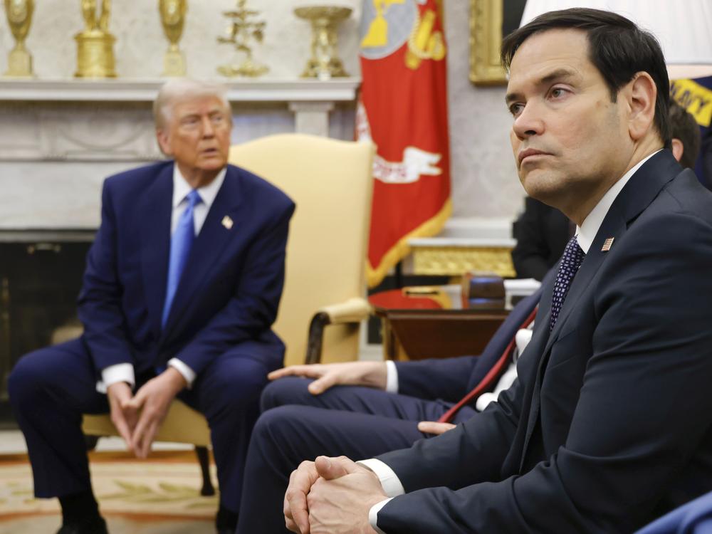 Secretary of State Marco Rubio, right, listens as President Trump, left, meets with France's President Emmanuel Macron in the White House on Feb. 24.