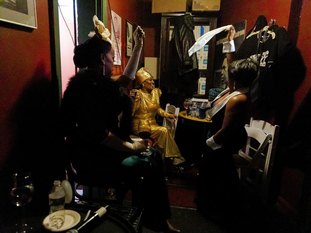 Sky Covington (from left), Lady Vonne and Veronique Musique celebrate backstage after performing in Covington's 