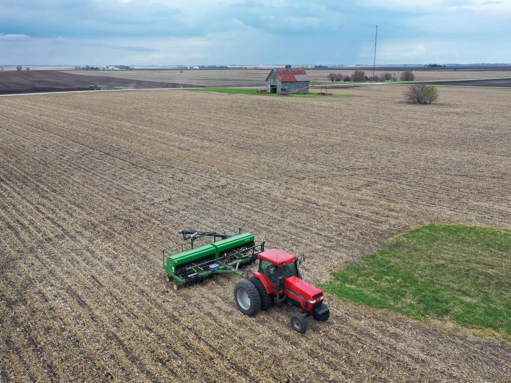 An aerial view from a drone shows a farmer planting soybeans near Dwight, Ill., on April 23, 2020. China retaliated against Trump's latest tariffs by imposing its own taxes on U.S. imports, including on soybeans.