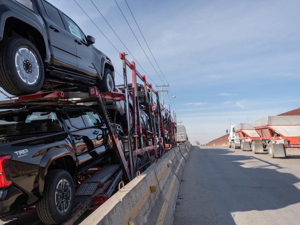 A car carrier trailer drive to cross to the U.S. at Otay Commercial port in Tijuana, Mexico on January 31. President Donald Trump's threatened tariffs on Mexico and Canada, set to go into effect on Tuesday, would hurt the Mexican economy — but also hurt auto plants in the U.S.