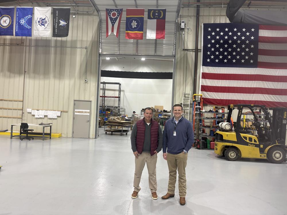 Hyperion Technology, a defense contractor in Tupelo, Miss., says it hasn't seen any tariff-related disruptions thus far due to the Trump administration. Hyperion CEO Gerald Godbold (L) and human resources officer Clint Gannon (R) stand on the shop's floor.