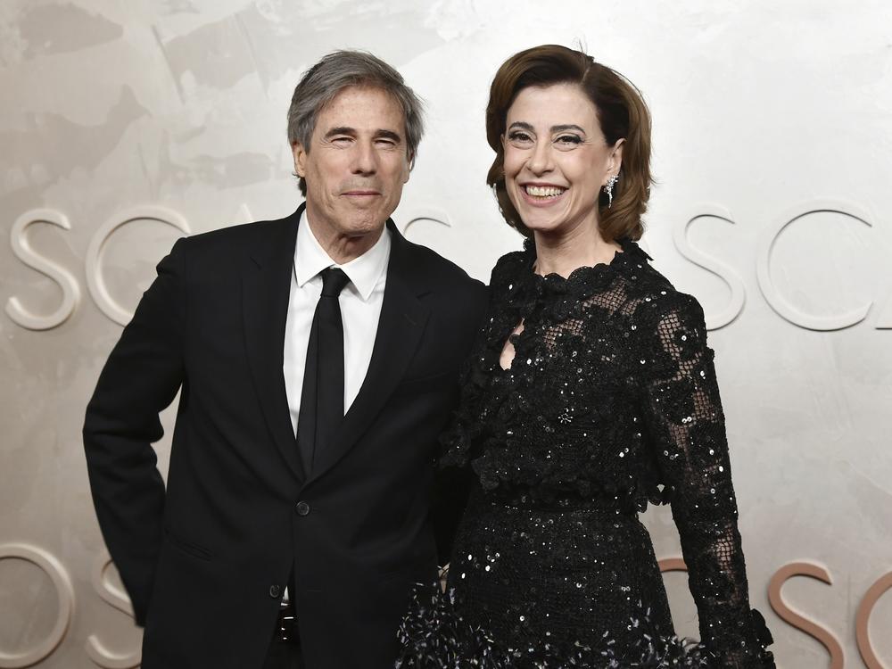 <em>I'm Still Here</em> director Walter Salles, left, and star Fernanda Torres arrive at the Oscars on Sunday.