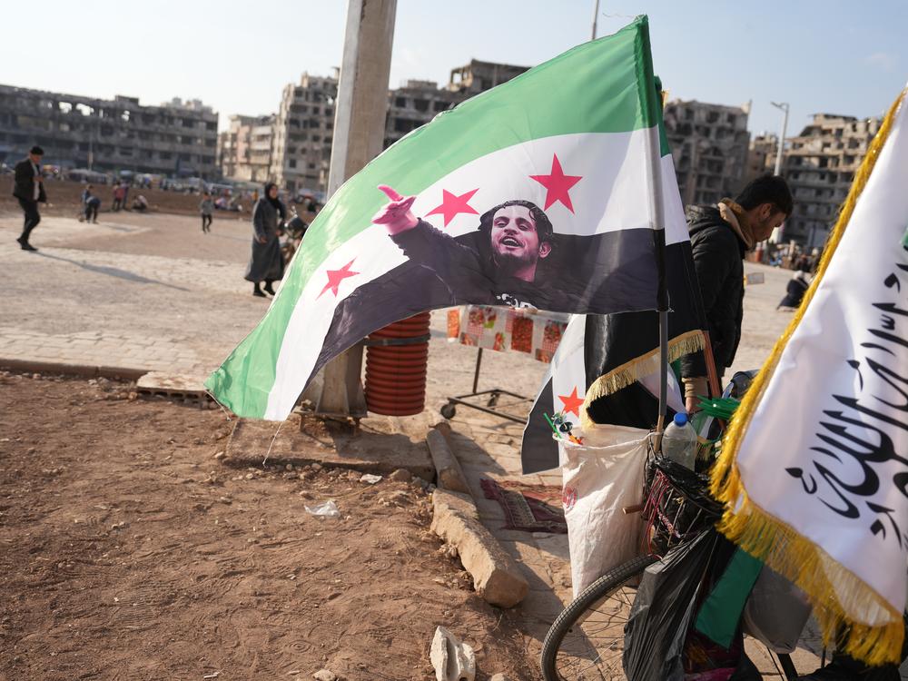 A flag with a photo of Abdel Basset al-Sarout is seen in Homs, Syria, on Jan. 31.