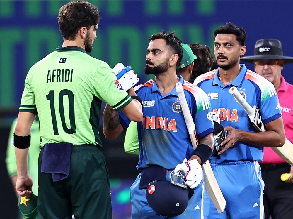 India's Virat Kohli and Axar Patel shake hands with Pakistan's Shaheen Shah Afridi (left) at the end of the ICC Champions Trophy one-day international cricket match between Pakistan and India at the Dubai International Stadium on Feb. 23.