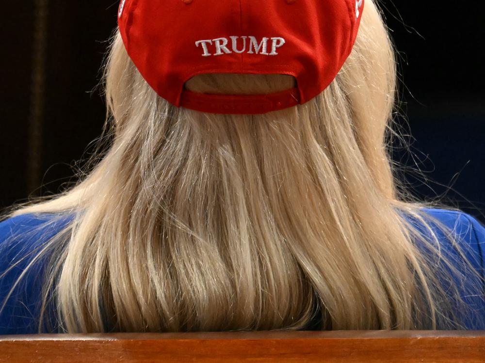 Representative Marjorie Taylor-Greene (R-GA) listens as US President Donald Trump speaks during an address to a joint session of Congress.