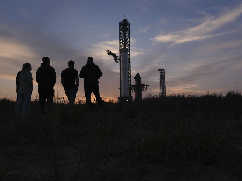Visitors watch as SpaceX's mega rocket Starship is prepared for a test flight from Starbase in Boca Chica, Texas, Sunday, March 2, 2025.