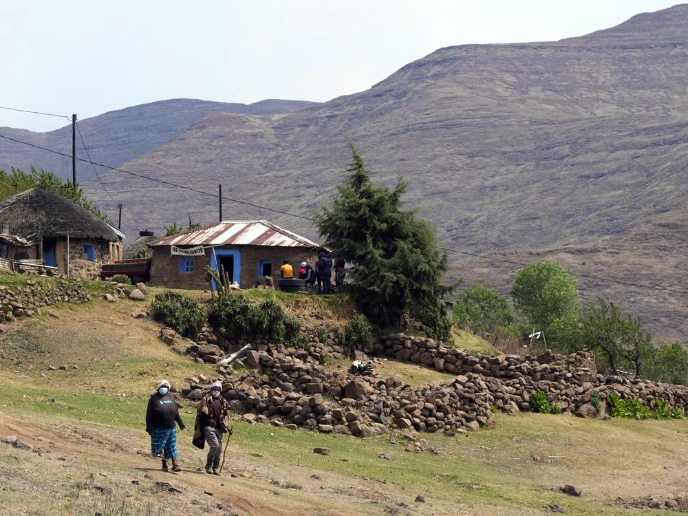 Women leave the poling station after casting their vote in Thaba-Tseka district, Lesotho, on Oct. 7, 2022.