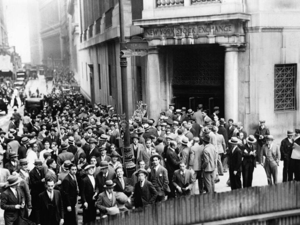 Crowds outside the New York Stock Exchange during the Wall Street Crash in the Financial District of Lower Manhattan, New York City, New York, Oct. 1929.