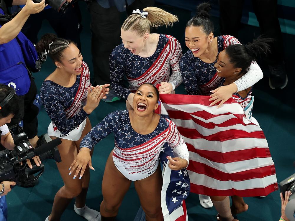 (L-R) Hezly Rivera, Jordan Chiles, Jade Carey, Sunisa Lee and Simone Biles of Team USA celebrate winning the gold medals after the Artistic Gymnastics Women's Team Final on day four of the Olympic Games Paris 2024.