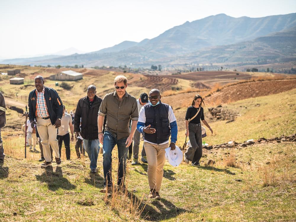 Prince Harry is welcomed by a community leader during a visit of Leribe, Lesotho, on Oct. 2, 2024.