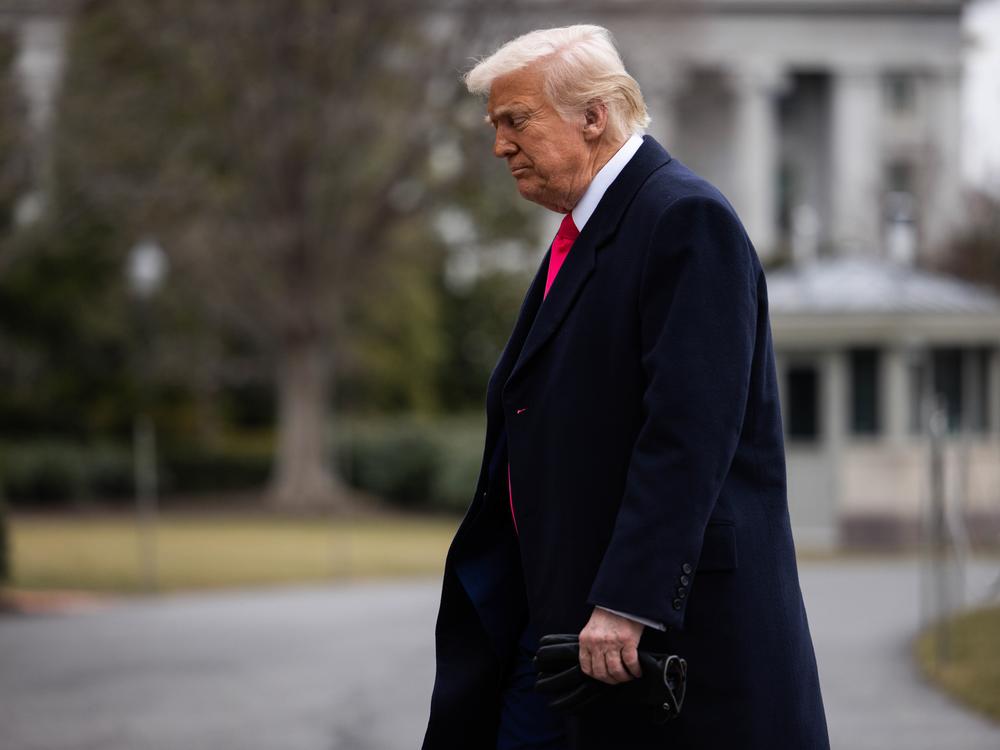 President Trump walks to the Residence after arriving to the White House on Feb. 22. The administration is facing legal challenges over its effort to freeze payments for federal grants and other programs.