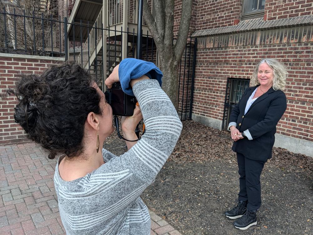 Photographer Rachel Utain-Evans takes headshots for newly laid off federal employee Janice Barlow