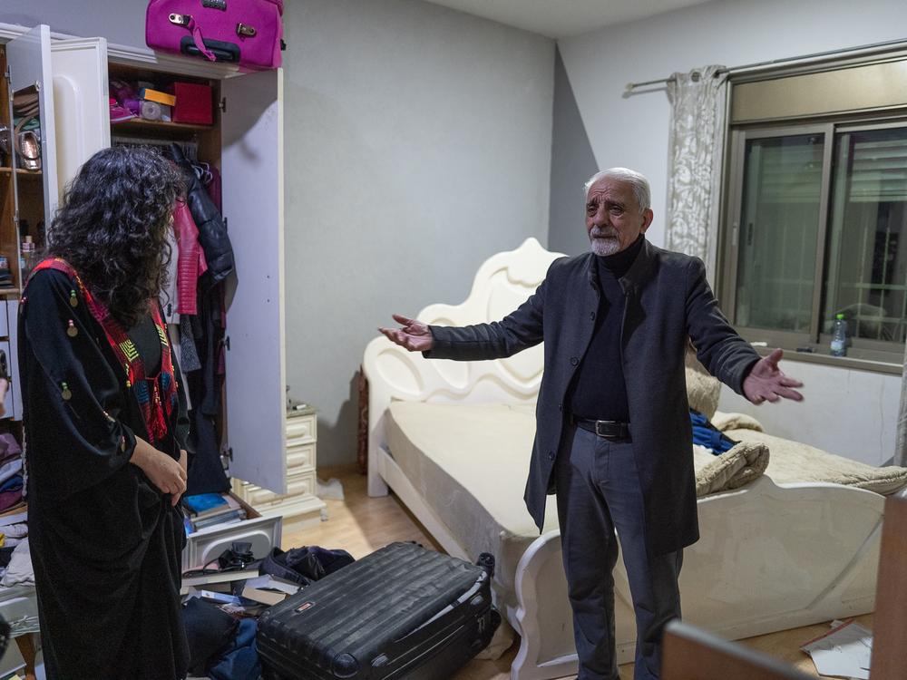 Moneer Zughayer reacts after Israeli forces searched his home in East Jerusalem, following the celebration of the release from prison of a relative.