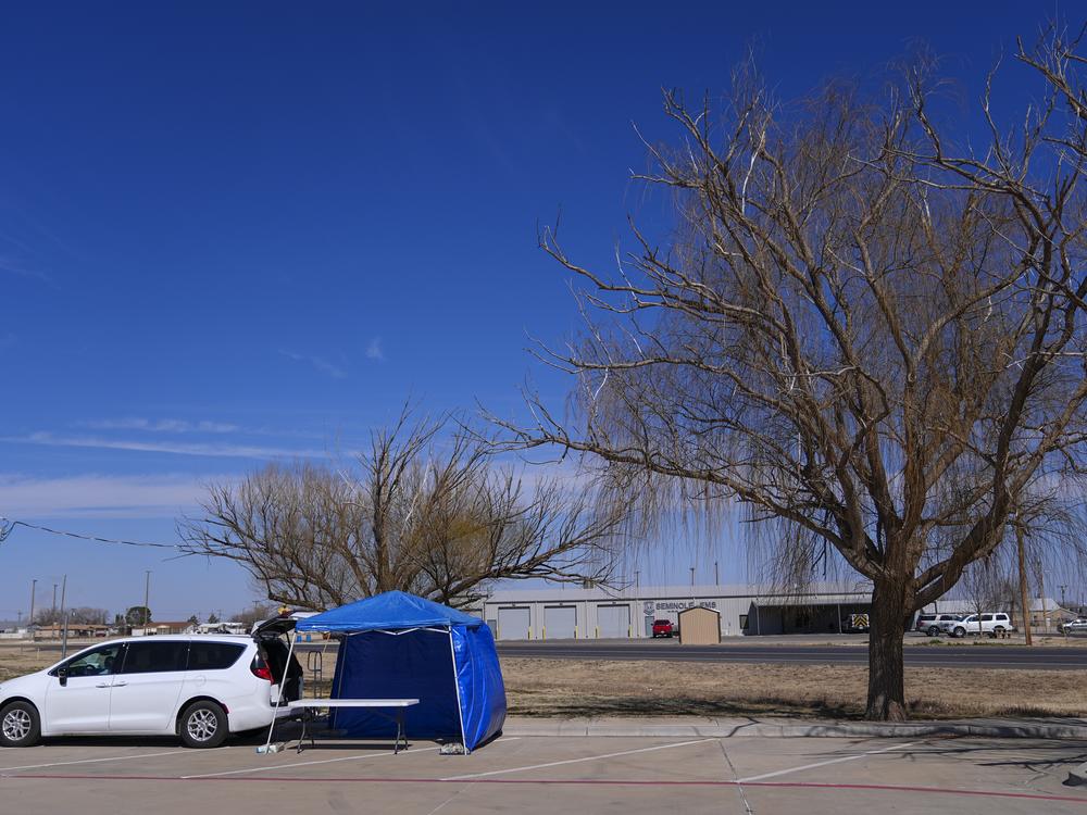 A van is seen at the site of a measles testing location in the parking lot of Seminole Hospital District on Feb. 21 in Seminole, Texas.
