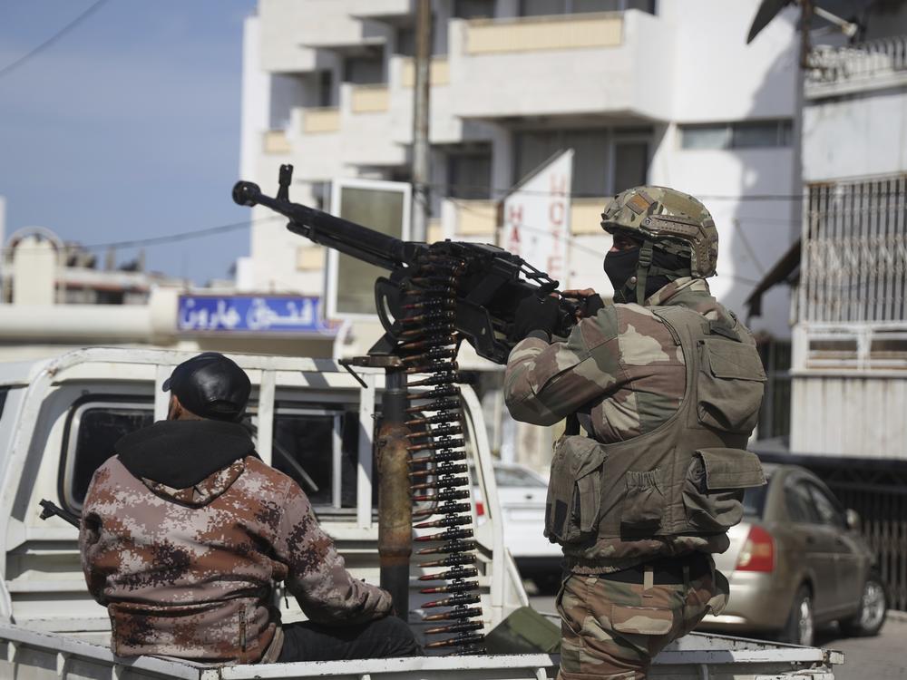 Syrian security reinforcements deploy in Latakia, Syria, on Friday.