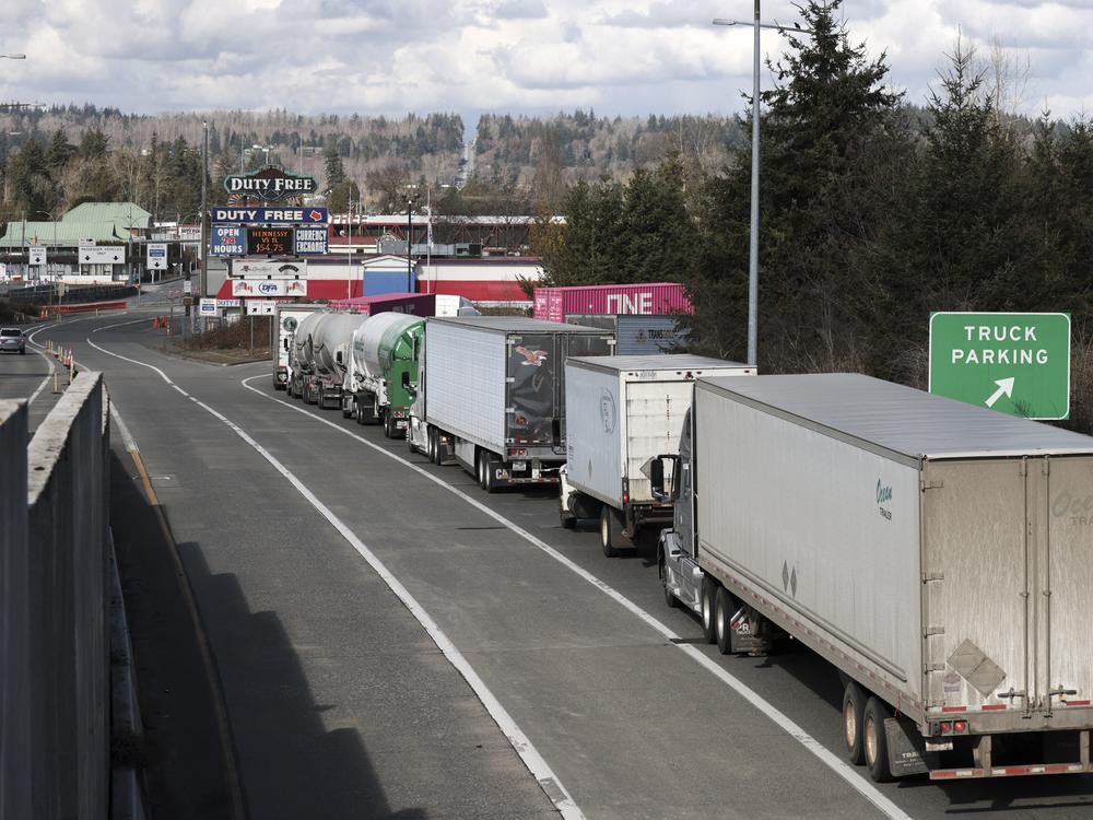 A line of trucks traveling into Canada are pictured at the Pacific Highway U.S.-Canadian border crossing in Blaine, Wash., on March 5.