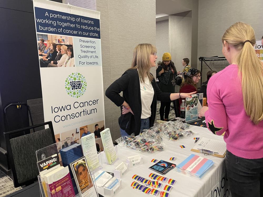 Bri McNulty does public health outreach at a conference in Iowa.