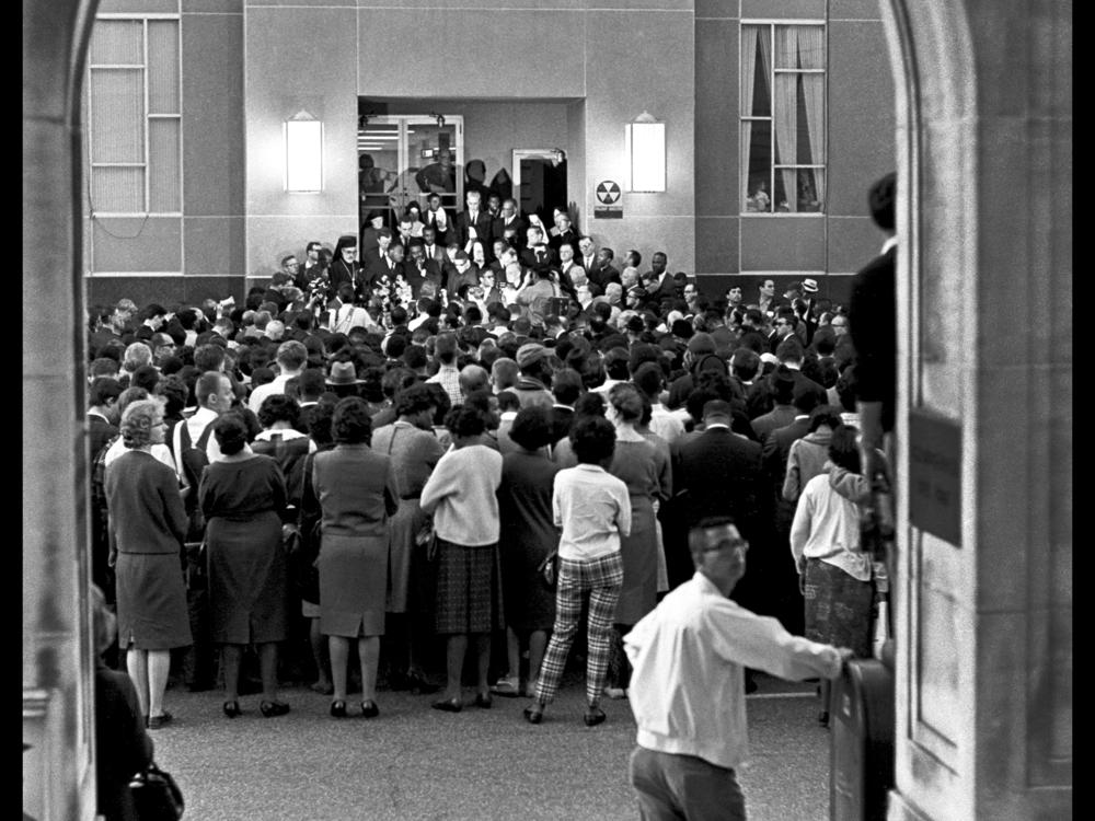 Marchers lay a wreath on the steps of the Dallas County Courthouse after the memorial for James Reeb, a white minister who was murdered for joining the protests.