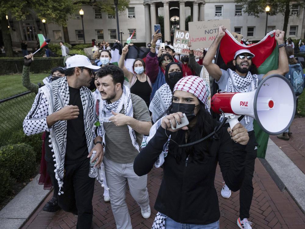 Pro-Palestinian supporters, including Mahmoud Khalil (second from left), demonstrate during a protest at Columbia University in New York in October 2023.