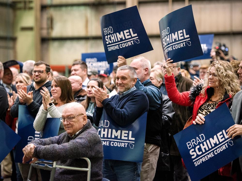 Attendees applaud as Brad Schimel announces his run for Wisconsin State Supreme Court on Thursday, Nov. 30, 2023, in Waukesha, Wis.