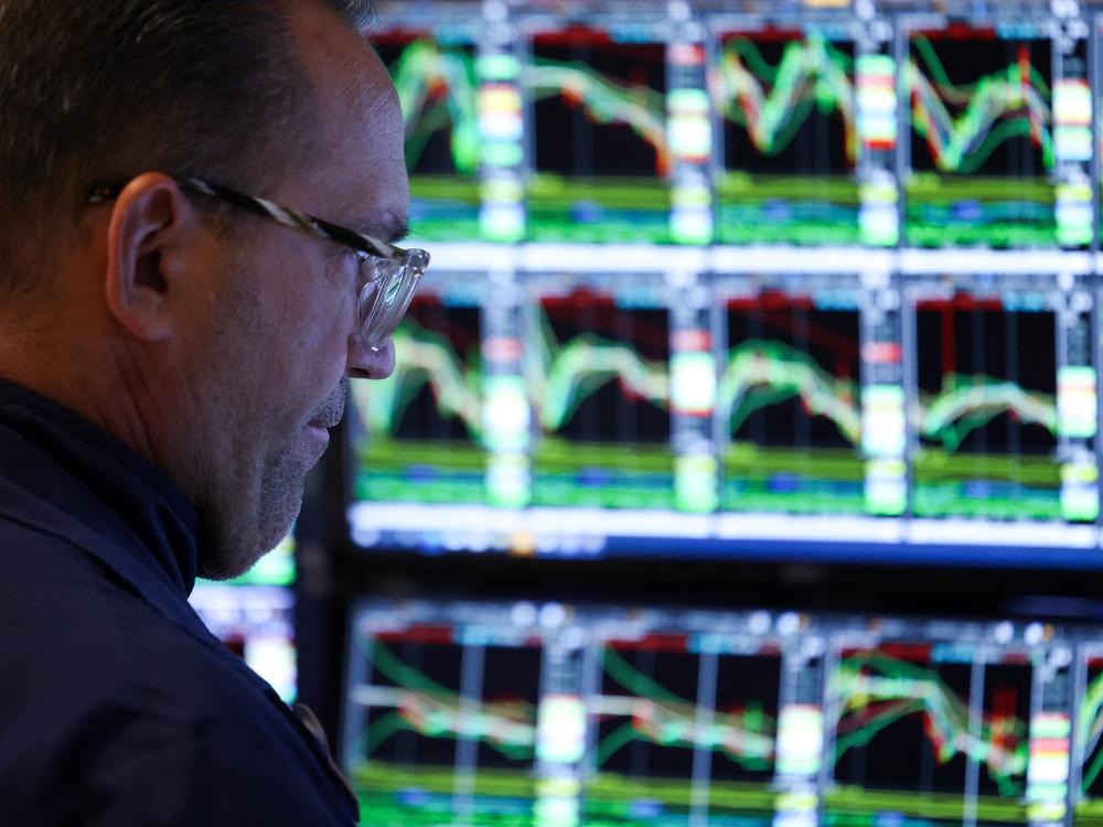 A trader works on the floor of the New York Stock Exchange (NYSE) at the opening bell in New York City on March 10, 2025.