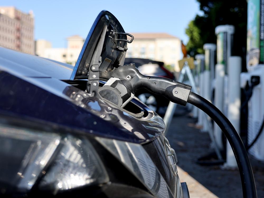 A Nissan LEAF recharges at a station in Pasadena, Calif. Memos obtained by NPR show a key federal agency has paused orders of zero-emission vehicles and some federally-owned EV chargers will be shut off.