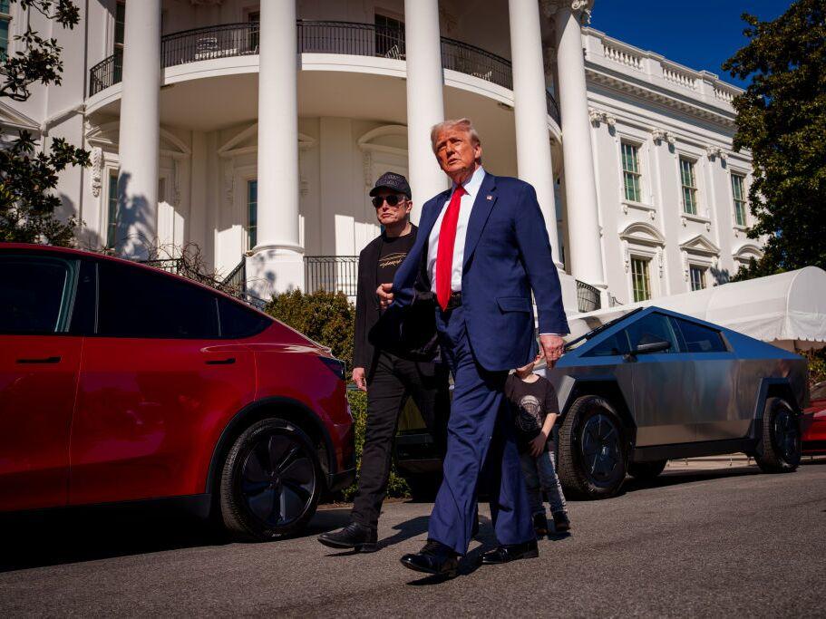 President Trump and White House senior adviser, Tesla and SpaceX CEO Elon Musk depart after looking at Tesla vehicles on the South Lawn of the White House on Tuesday.