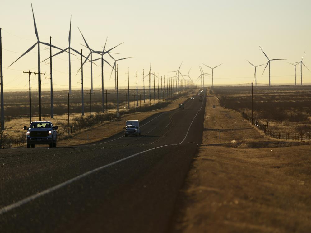 Wind turbines along a highway in Andrews, Texas.