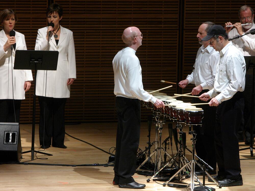Steve Reich (in black cap) with his ensemble perform <em>Drumming</em> at the composer's 70th birthday celebration at Zankel Hall, in New York, in 2006.